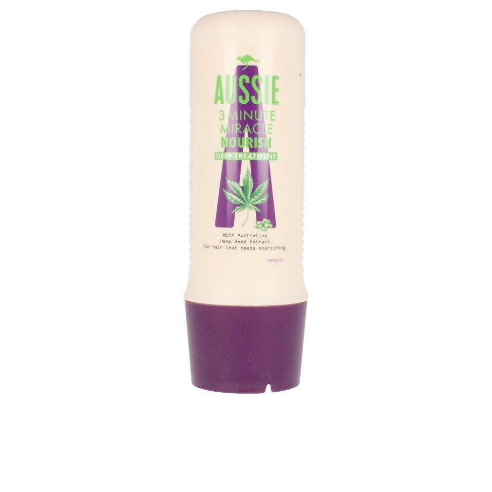 Tubo beige con base viola. Scritta: Aussie 3 Minute Miracle Nourish Deep Treatment. Con estratto di semi di canapa.