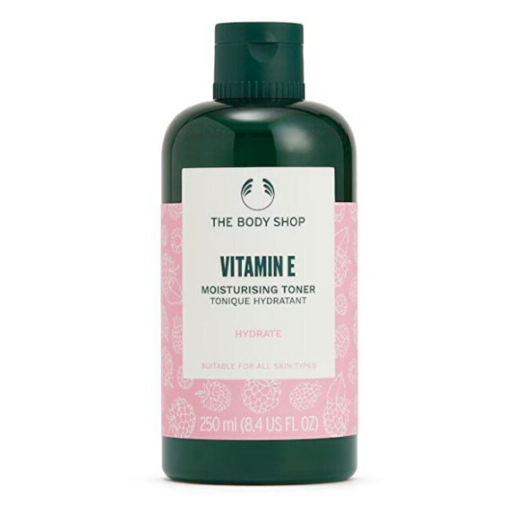 Flacone verde con etichetta rosa. Scritta: Vitamin E, Moisturising Toner, Hydrate. Marchio: The Body Shop. Adatto a tutti i tipi di pelle.