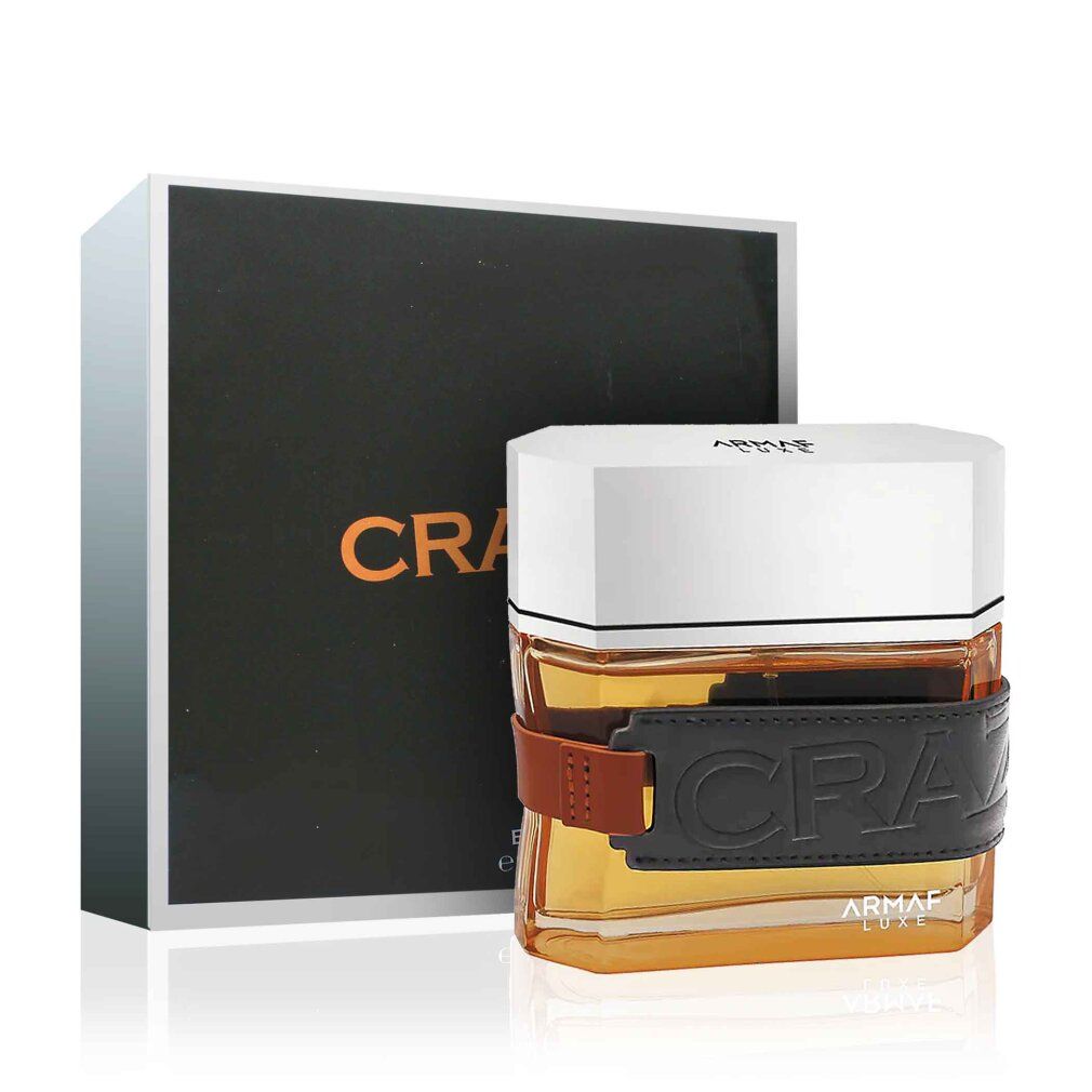 Flacone di profumo con fascia nera e confezione. Scritta "CRAZE FOR MEN".
