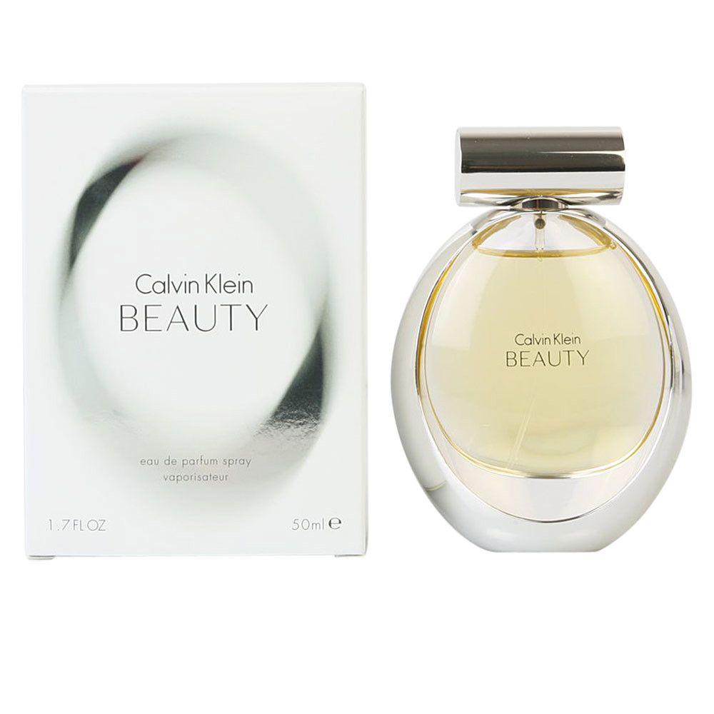 Spray profumo con confezione. Flacone con tappo argentato e design rotondo. Scritta: Calvin Klein BEAUTY.