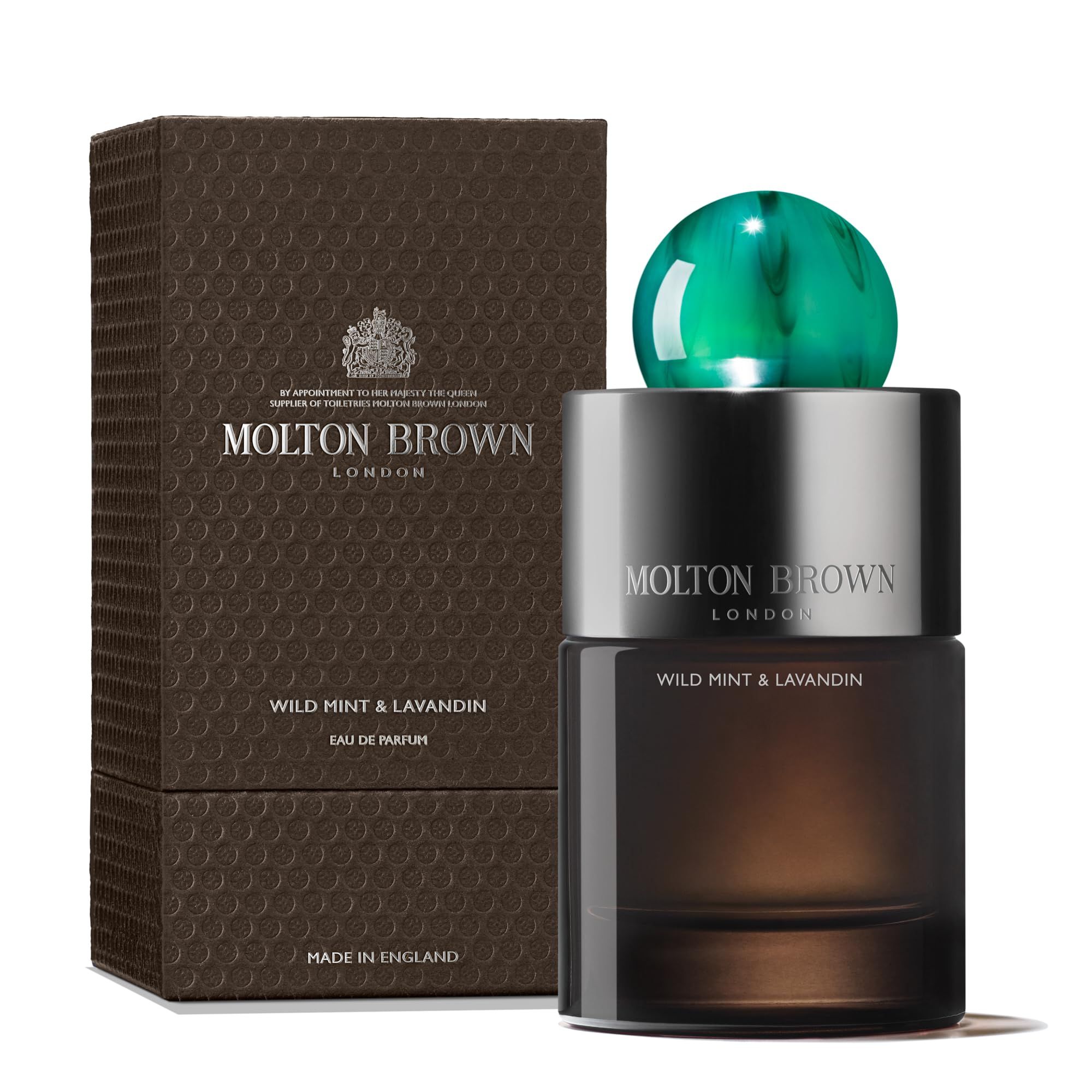 Flacone Molton Brown Wild Mint & Lavandin con confezione. Scatola marrone, flacone con chiusura verde. Testo: Molton Brown.
