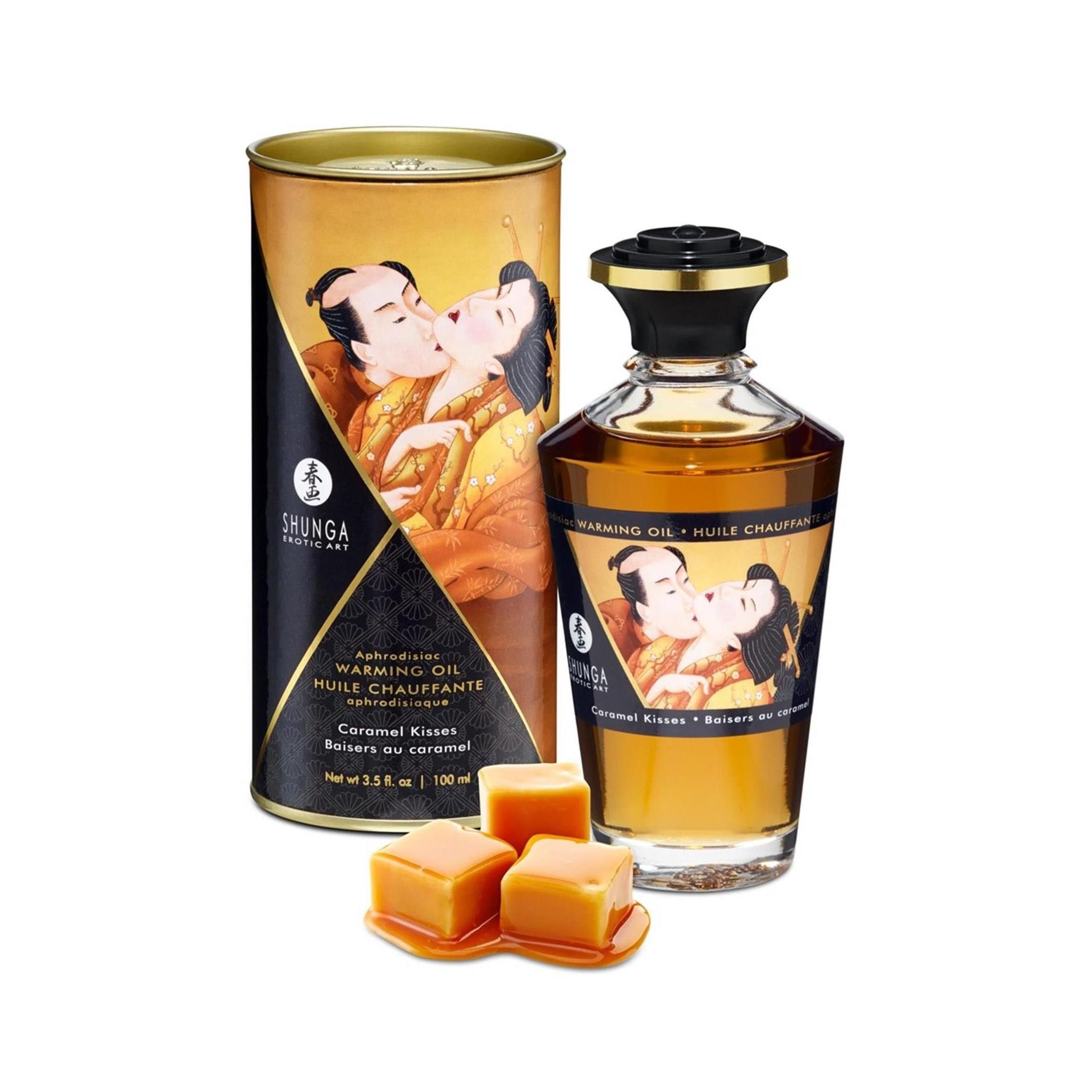 Scatola cilindrica e flacone d'olio. Scatola con illustrazione di coppia che si bacia. Flacone con tappo nero ed etichetta.