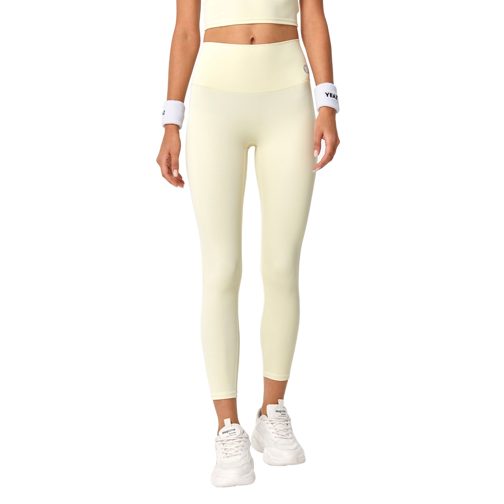 Leggings 3/4 gialli chiari aderenti a vita alta con fasce bianche ai polsi.