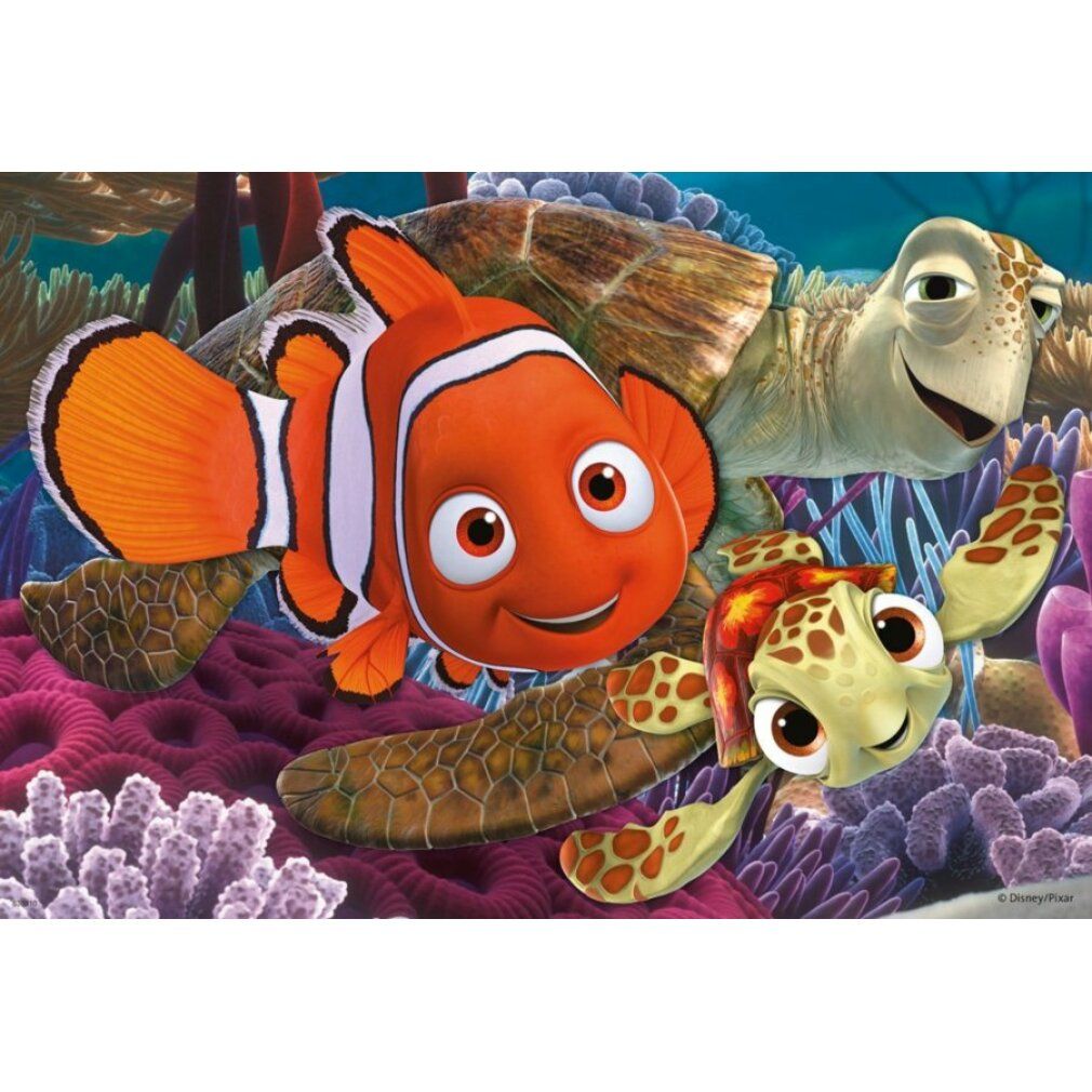 Puzzle con Nemo. Personaggi: pesce pagliaccio, stella marina, Dory, cavalluccio marino, medusa. Sfondo: barriera corallina. Puzzle Ravensburger.