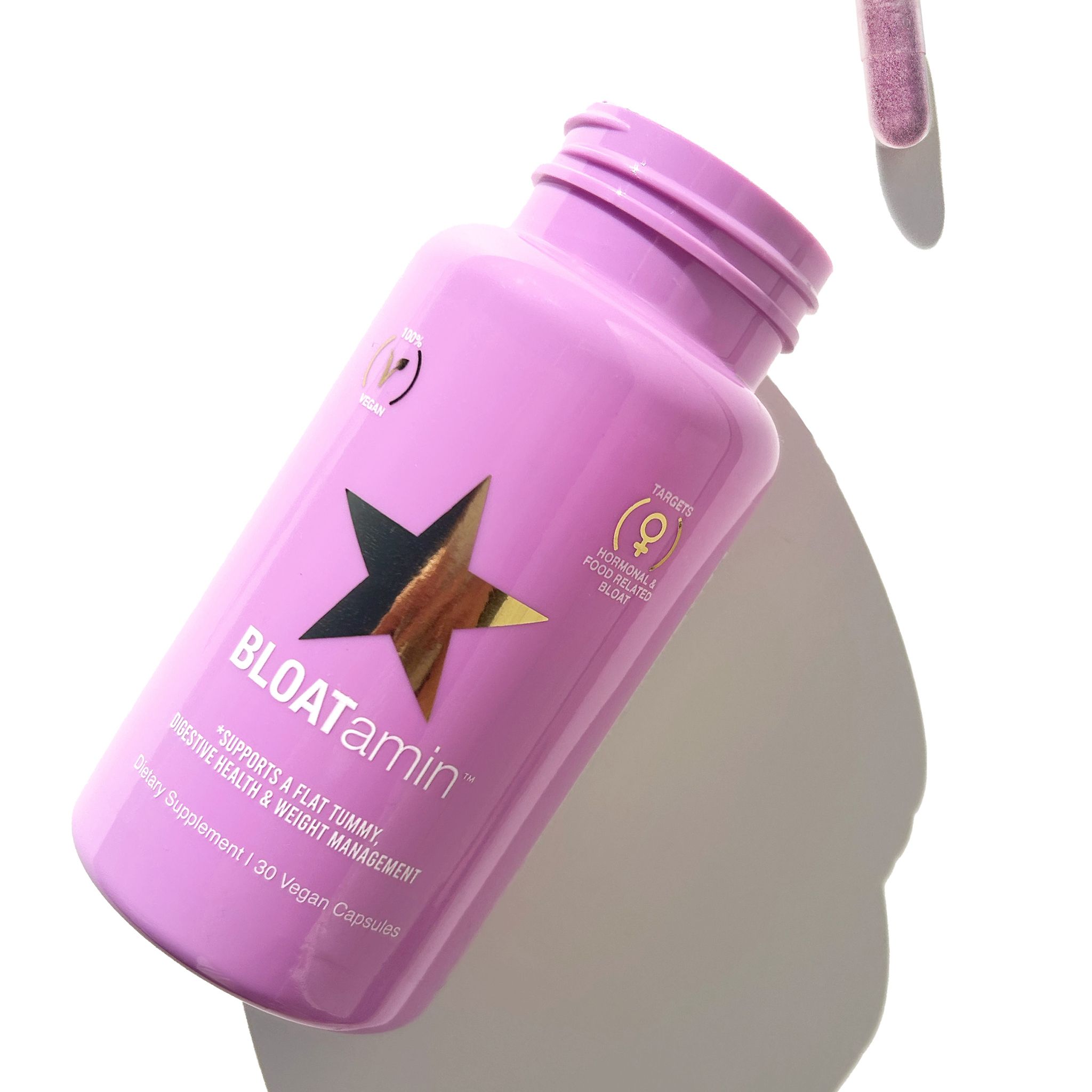 Flacone rosa con stella dorata e scritta BLOATamin™. Contiene 30 capsule vegane. Supporta la pancia piatta, la salute digestiva e la gestione del peso.