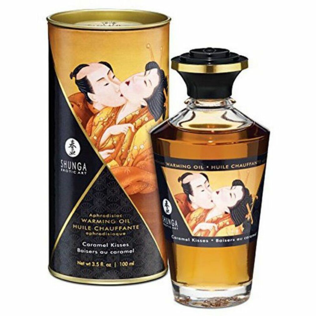 Flacone e confezione di olio. Scritta: Warming Oil, Caramel Kisses. Illustrazione di una coppia che si bacia. Marchio: Shunga.