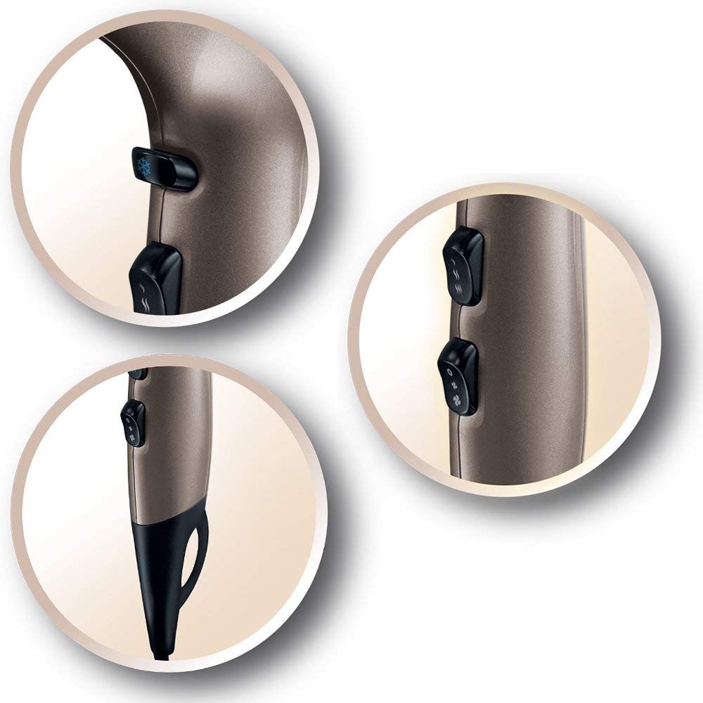 Primi piani di tre interruttori sull'asciugacapelli. Dettagli degli interruttori e dell'impugnatura in antracite-oro.