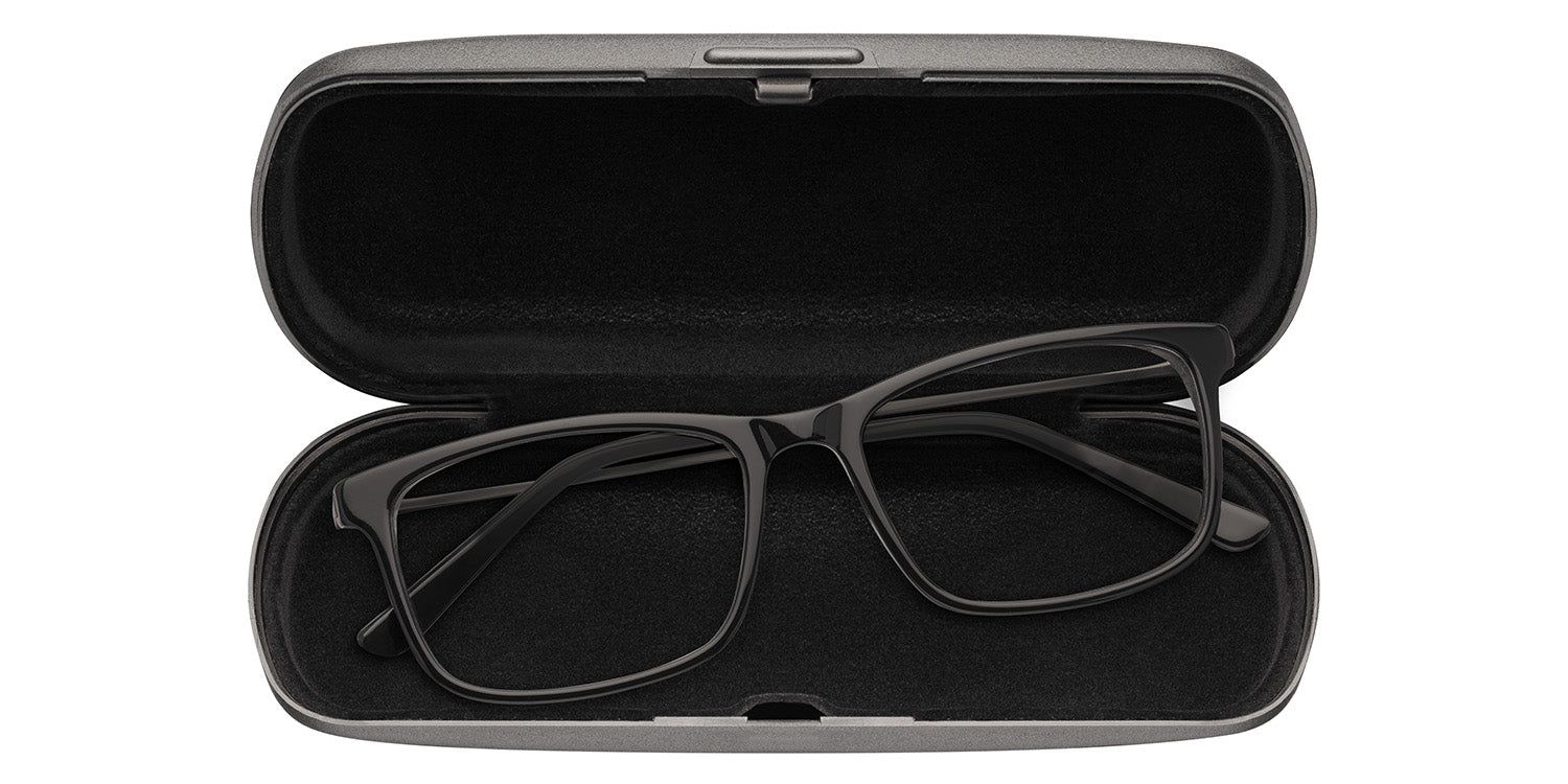 Custodia ovale aperta. Occhiali neri all'interno. Fodera nera.