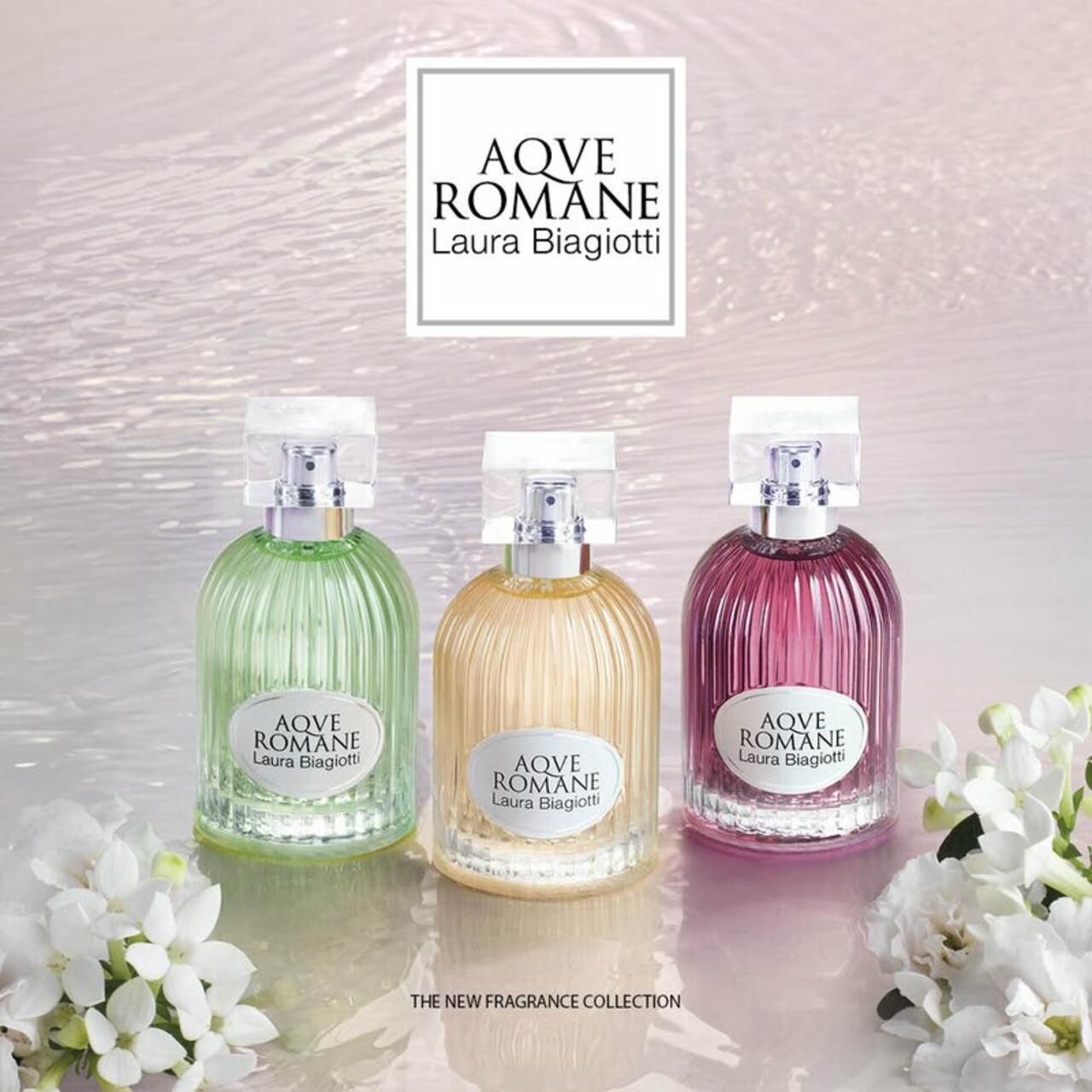 Tre flaconi di profumo Laura Biagiotti AQVE ROMANE in colori diversi.