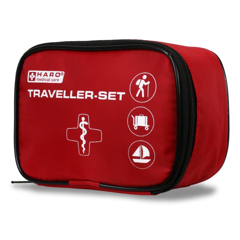 Borsa di pronto soccorso rossa con cerniera nera. Scritta: HARO medical care, TRAVELLER-SET. Simboli: escursionista, valigia, barca a vela.