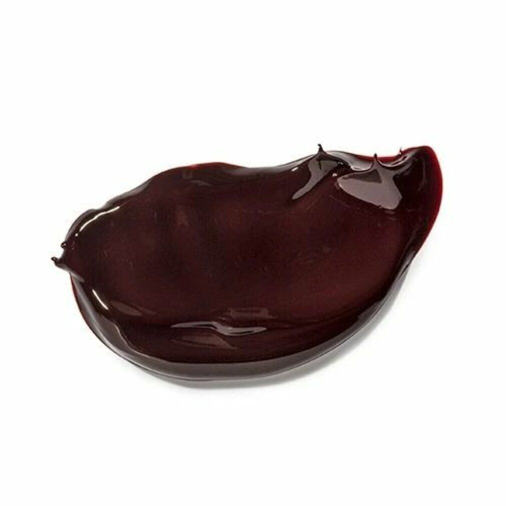 Macchia di crema marrone su sfondo bianco. Consistenza lucida.