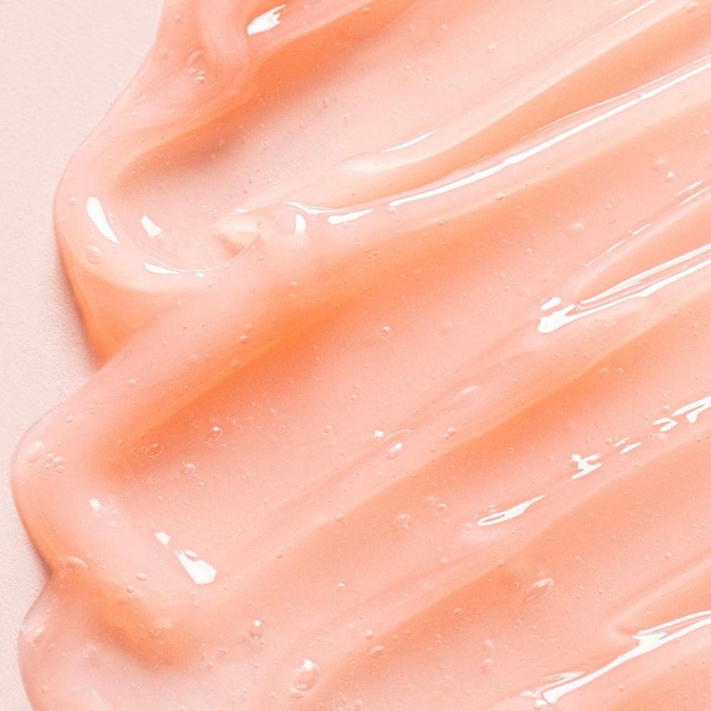 Primo piano della maschera labbra. Texture rosa e lucida. Superficie liscia.