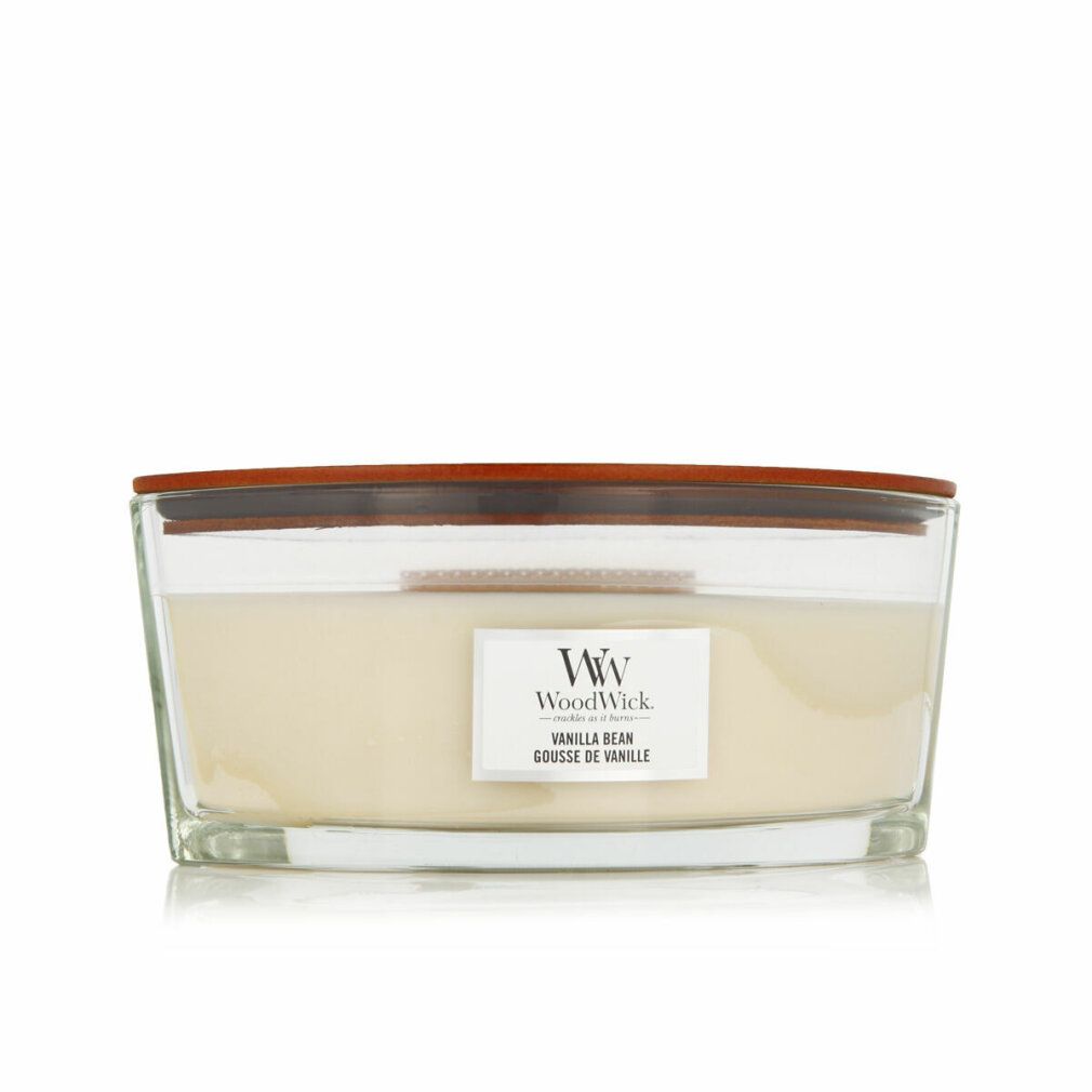 Candela in vetro, coperchio in legno. Etichetta "WoodWick Vanilla Bean".
