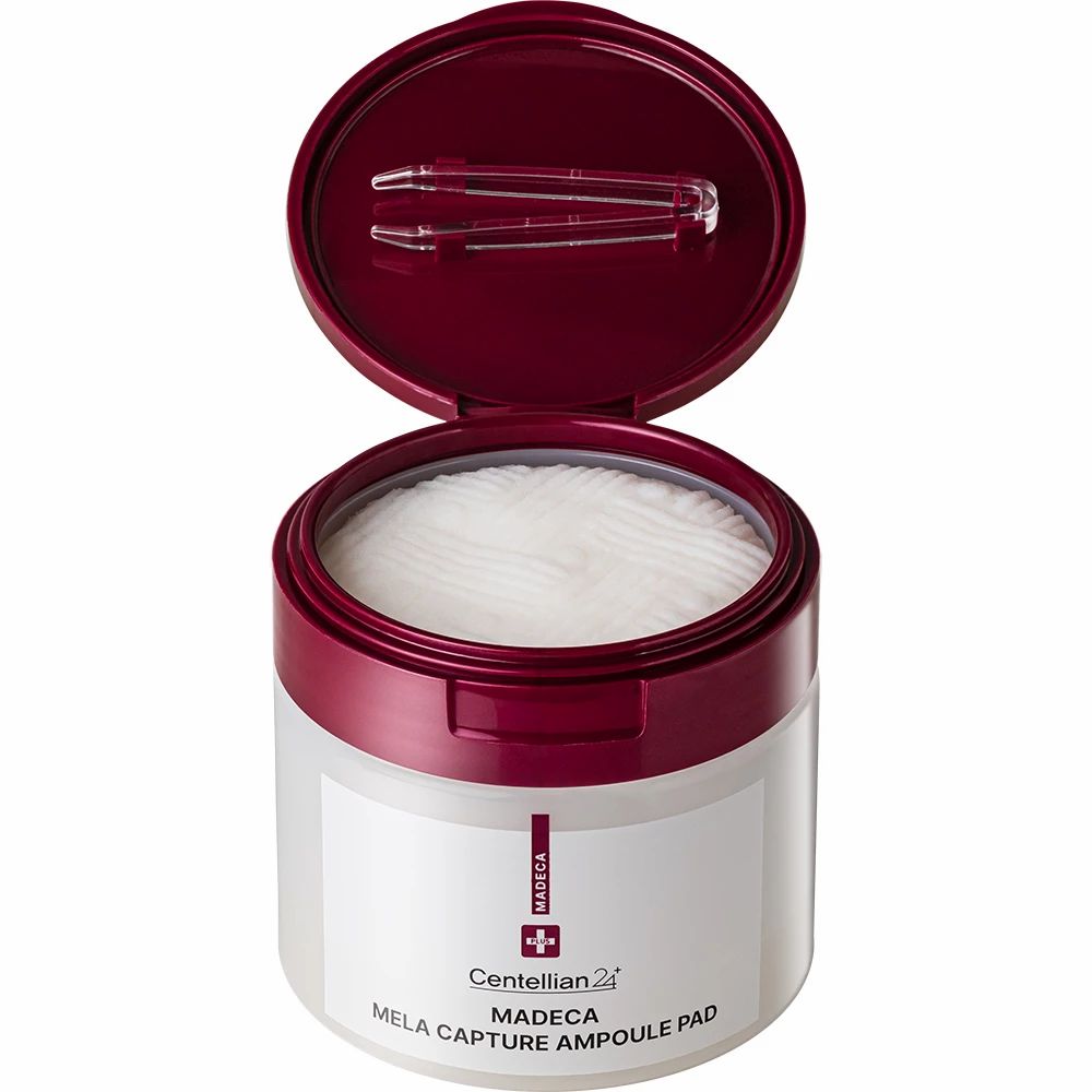 Barattolo bianco con coperchio rosso. Coperchio aperto, mostra pad e pinzetta. Nome del prodotto e marchio stampati.