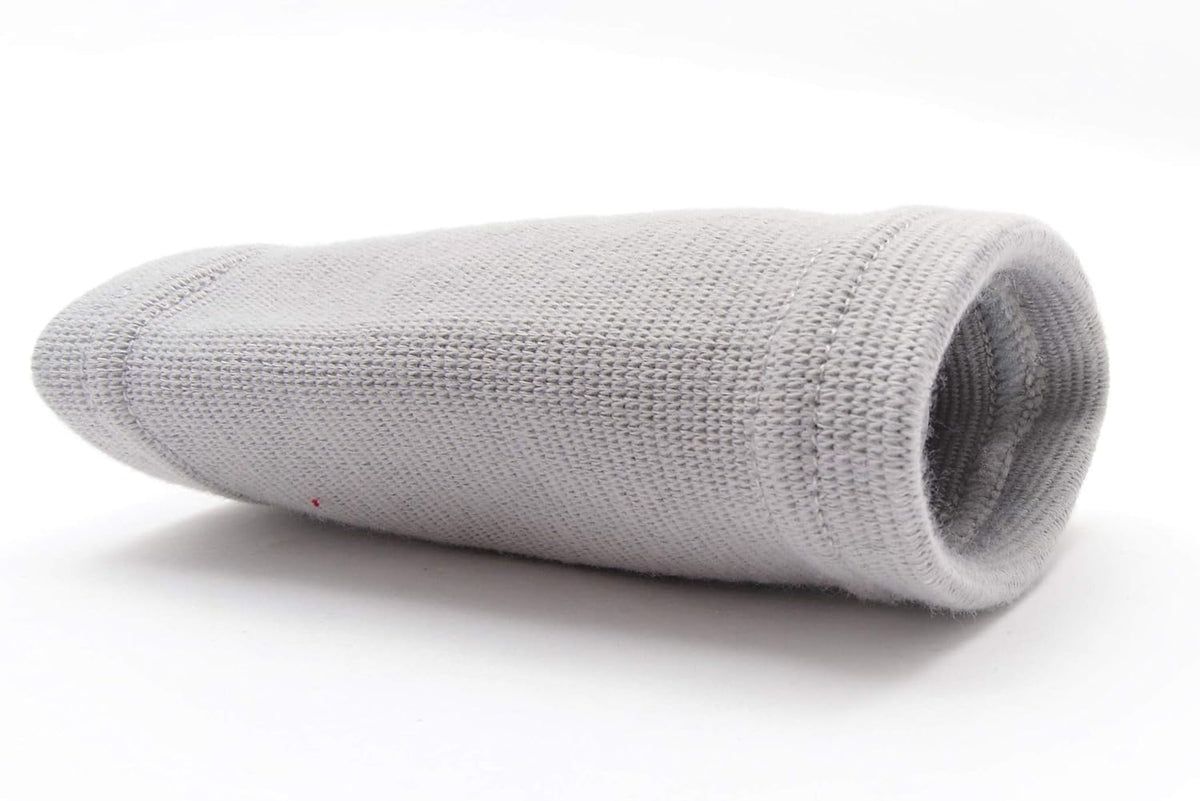 Tutore per polso grigio. Forma cilindrica, materiale a coste.