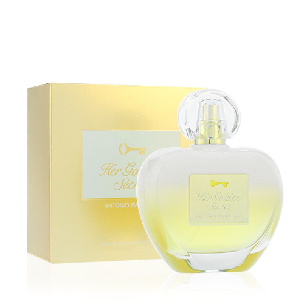 Flacone di profumo e scatola. Flacone a forma di cuore, dettagli dorati. Scritta: Her Golden Secret. Marchio: Antonio Banderas.