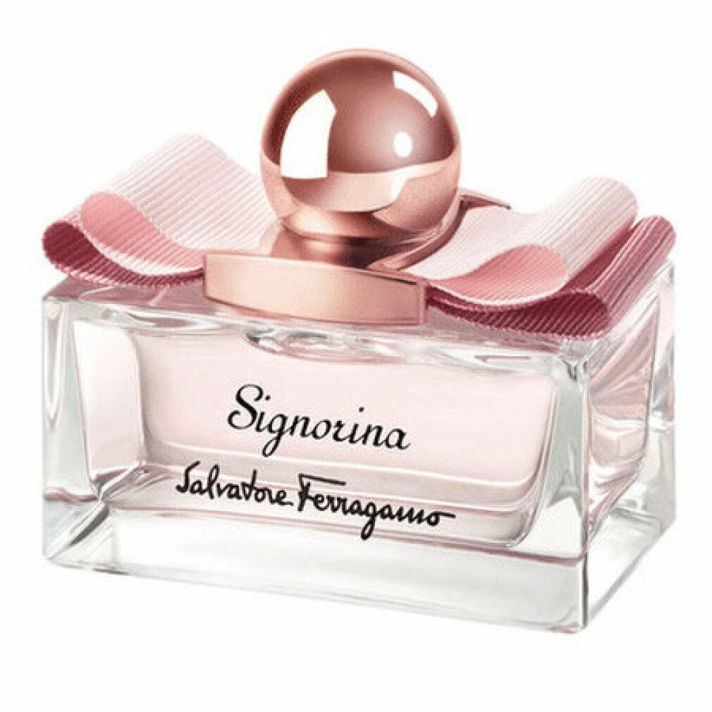 Flacone di profumo con fiocco rosa e tappo. Scritta Signorina e Salvatore Ferragamo.