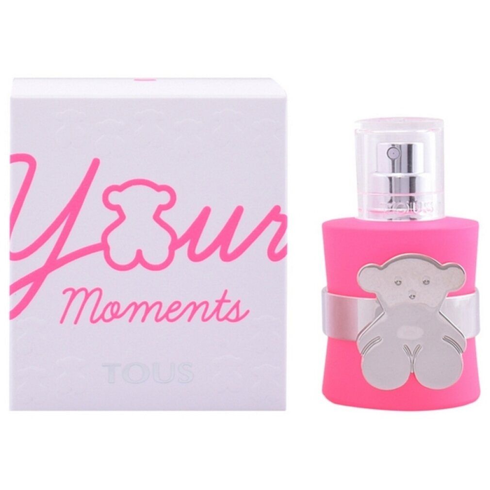 Flacone rosa con dettaglio orso argentato e confezione bianca con scritta rosa. Marchio: Tous.