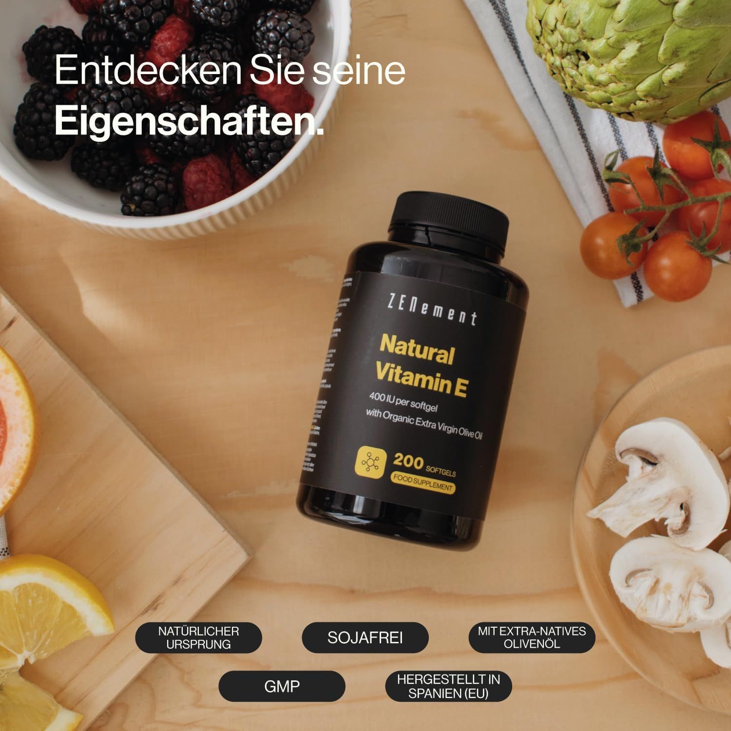 Flacone nero con softgel. Scritta: Natural Vitamin E, 200 softgel. Con olio d'oliva.