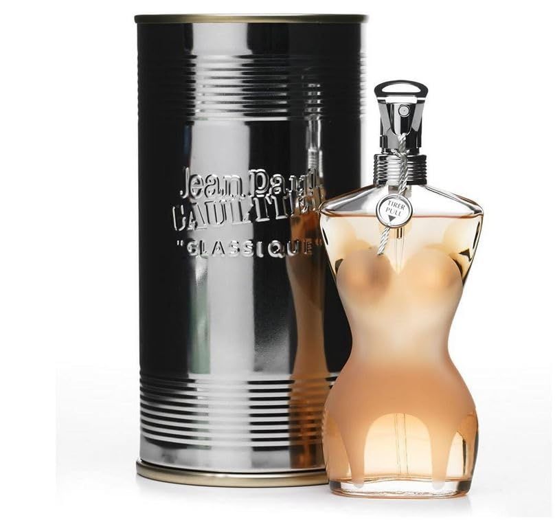 Flacone di profumo e scatola. Flacone a forma di corpo femminile, scatola cilindrica, argentata.