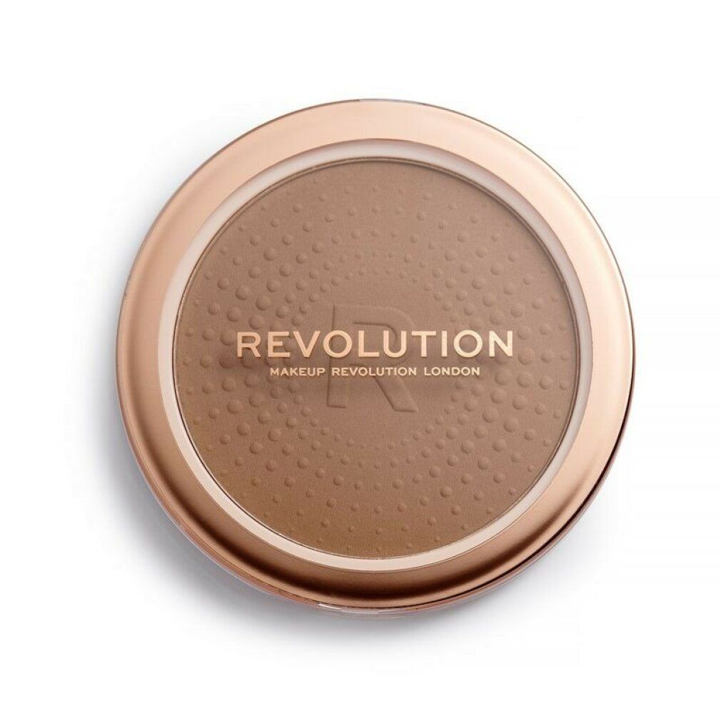 Bronzer rotondo in un contenitore dorato. Scritta REVOLUTION. Superficie puntinata.