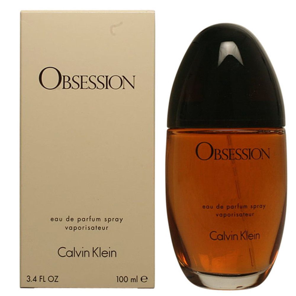 Flacone di profumo e confezione. Scritta Obsession, Calvin Klein. Flacone marrone, tappo nero.