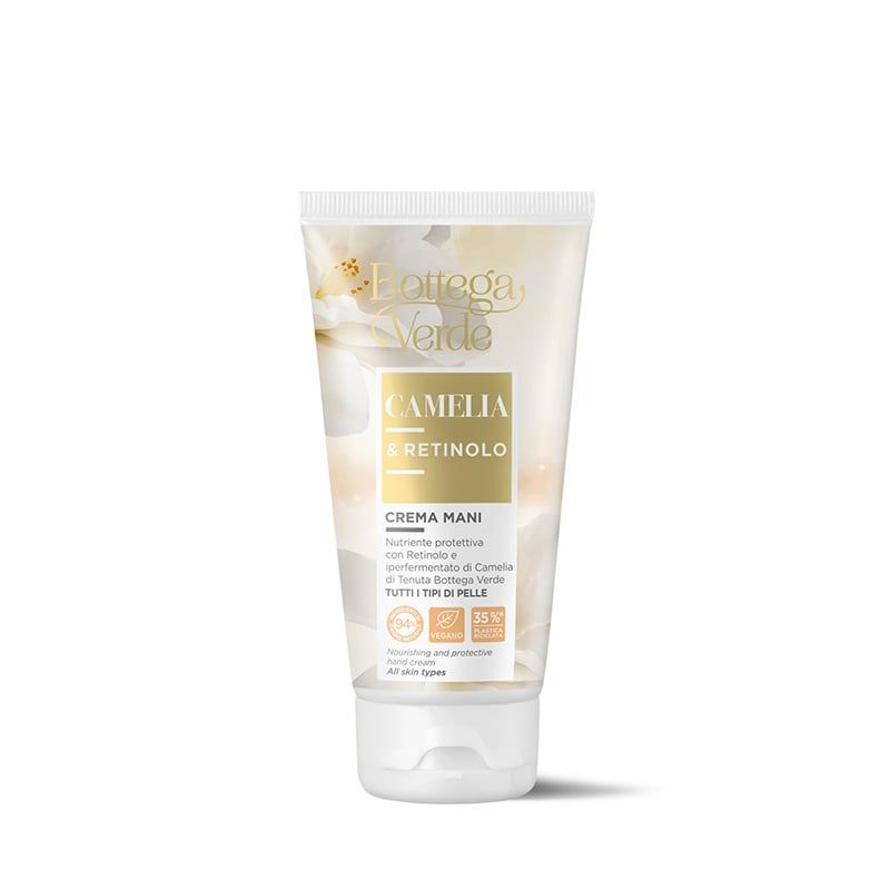 Tubo crema con nome e informazioni. Tubo bianco con etichetta dorata. Testo: Camelia & Retinolo, Crema mani.