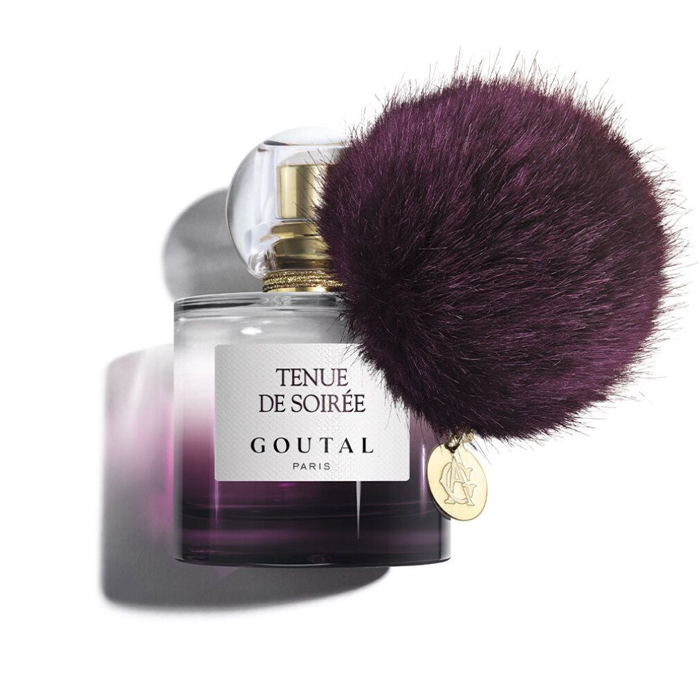 Flacone di profumo con pompon viola. Scritta: Tenue de Soirée, Goutal Paris. Chiusura dorata.