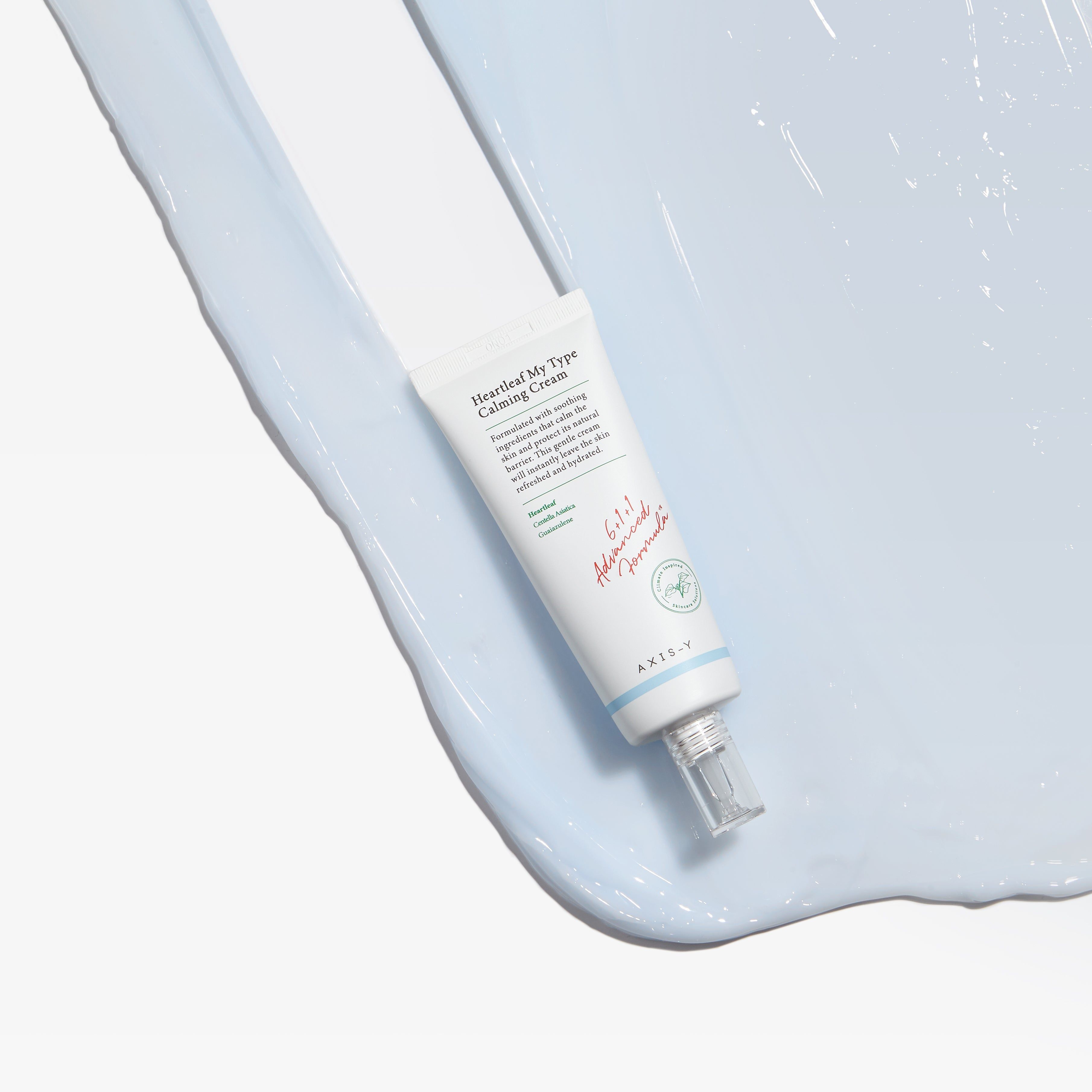 Tubo 'Heartleaf My Type Calming Cream' su sfondo blu. 'AXIS-Y' in basso.