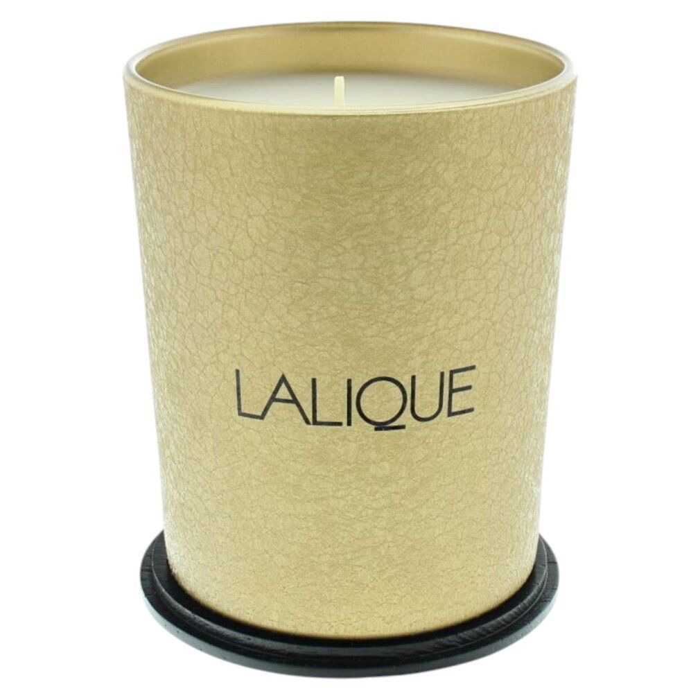 Candela dorata con sottobicchiere nero. Scritta: LALIQUE. Candela riempita di cera.
