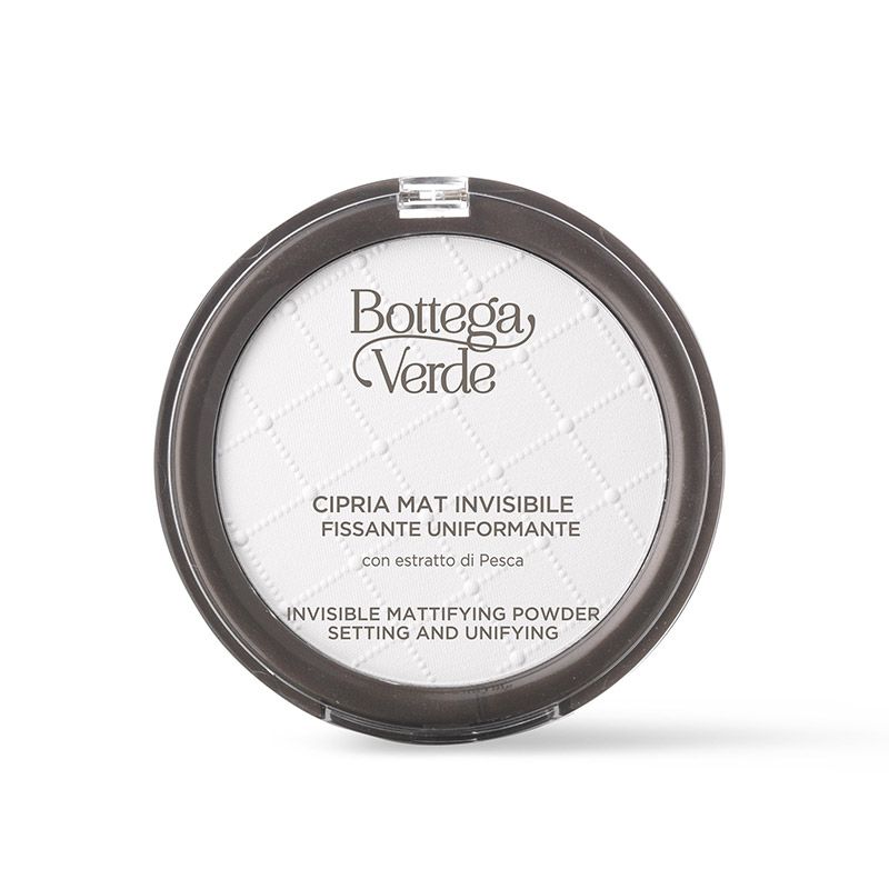 Contenitore rotondo grigio con polvere bianca. Scritta: Bottega Verde, Cipria Mat Invisibile. Testo in italiano e inglese.