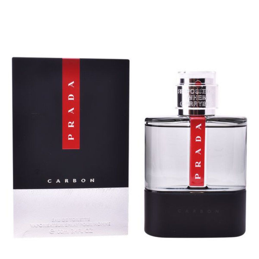 Scatola nera con striscia rossa e scritta PRADA. Flacone con striscia rossa e scritta CARBON.