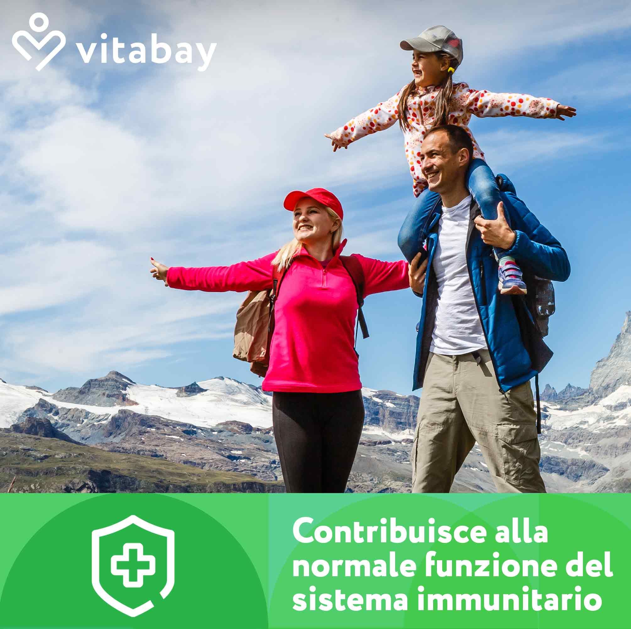 Famiglia con bambini in un paesaggio montano. "Contribuisce alla normale funzione del sistema immunitario".
