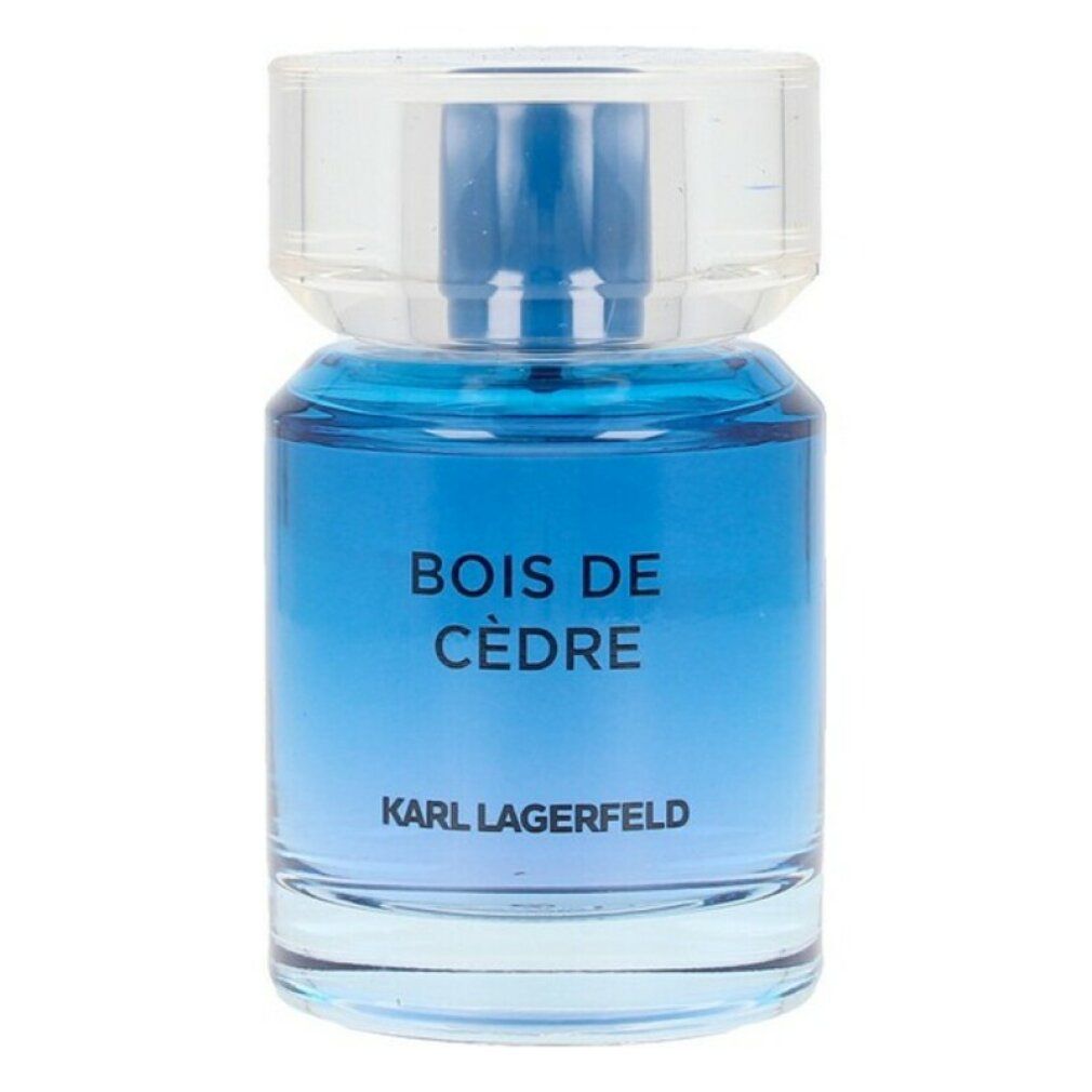 Flacone di profumo blu con tappo trasparente. Scritta: BOIS DE CÈDRE e KARL LAGERFELD.