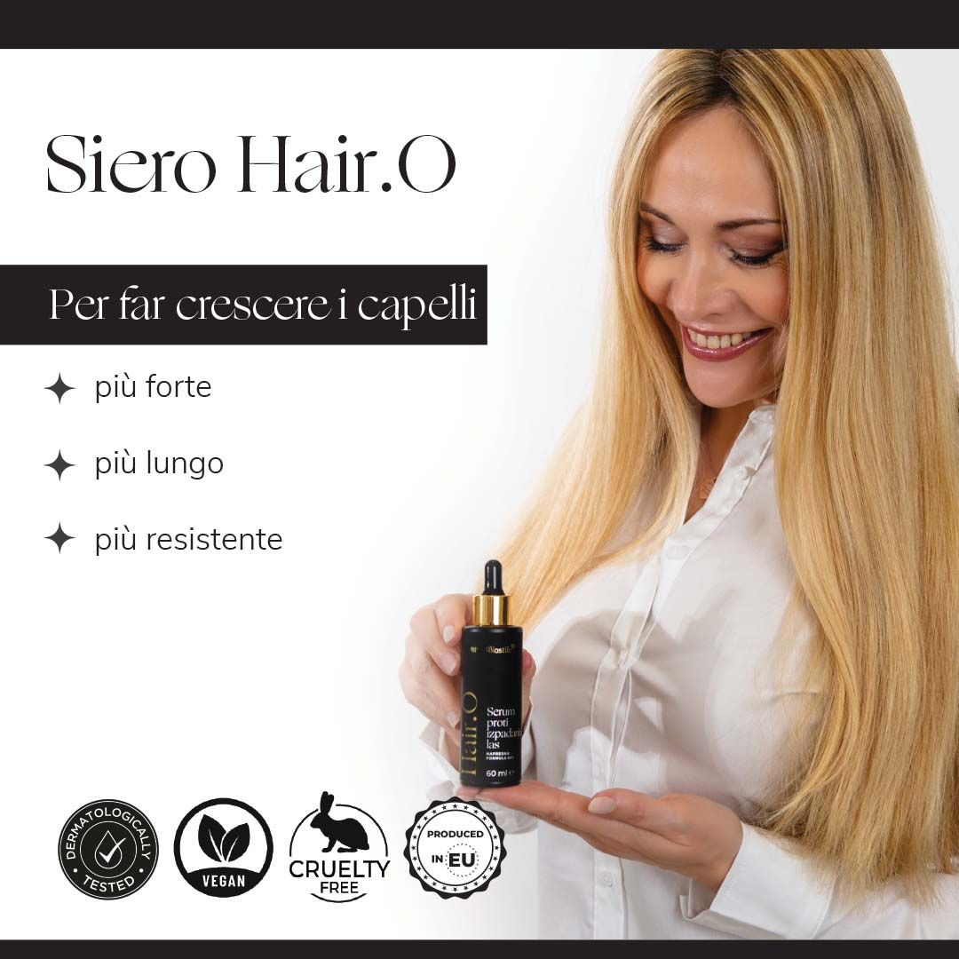 Donna tiene un flacone di Hair.O Serum. Testo: più forte, più lungo, più resistente. Vegano, Cruelty Free, Dermatologicamente testato.