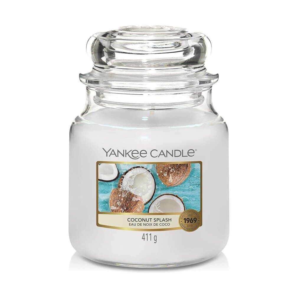 Vaso di vetro con coperchio. Adesivo con motivo cocco e scritta "Yankee Candle Coconut Splash". Adesivo con testo "411g" e "1969".