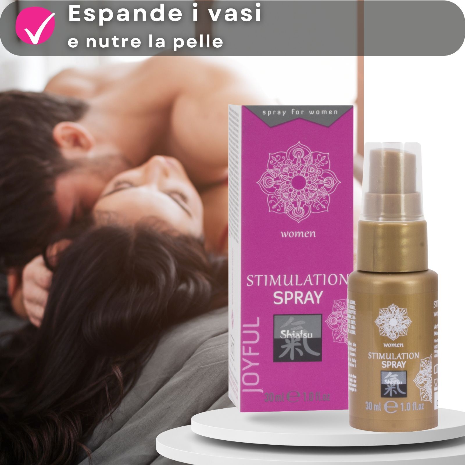 Flacone dorato e confezione. Testo: Stimulation Spray, Shiatsu. Coppia sullo sfondo.