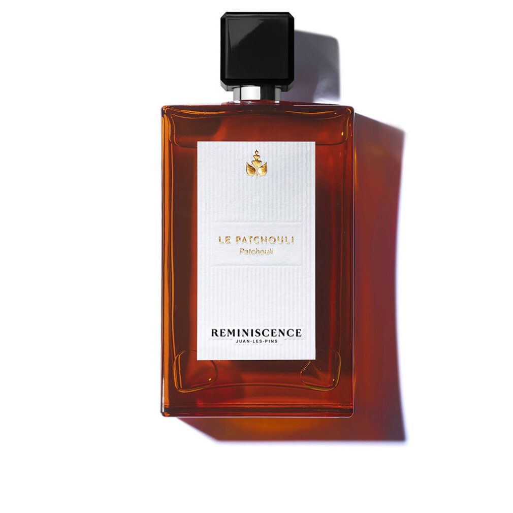 Flacone rettangolare in vetro ambrato con tappo nero. Etichetta bianca con testo "LE PATCHOULI" e "REMINISCENCE".