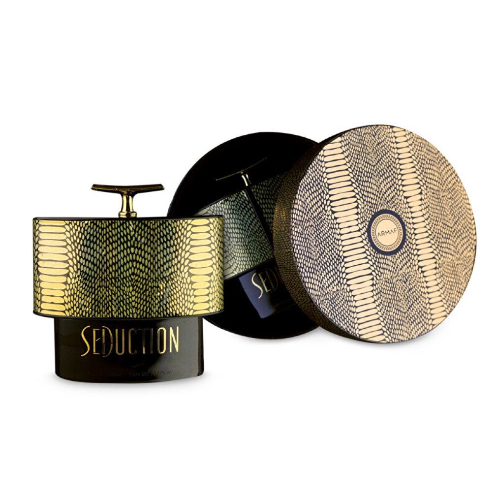 Flacone di profumo e scatola aperta. Motivo a pelle di serpente dorato. Scritta Seduction Pour Femme Eau De Parfum. Base nera.
