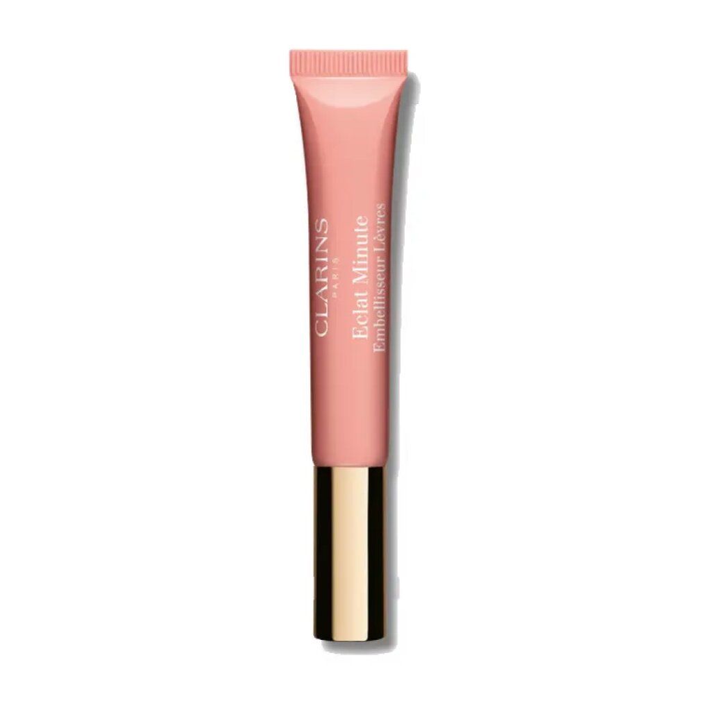 Clarins Lip Perfector in tubo rosa. Tappo dorato. Scritta: Clarins Paris, Eclat Minute Embellisseur Lèvres.