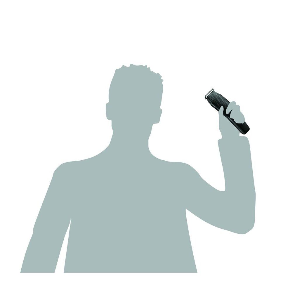 Silhouette di una persona che tiene un tagliacapelli nero.