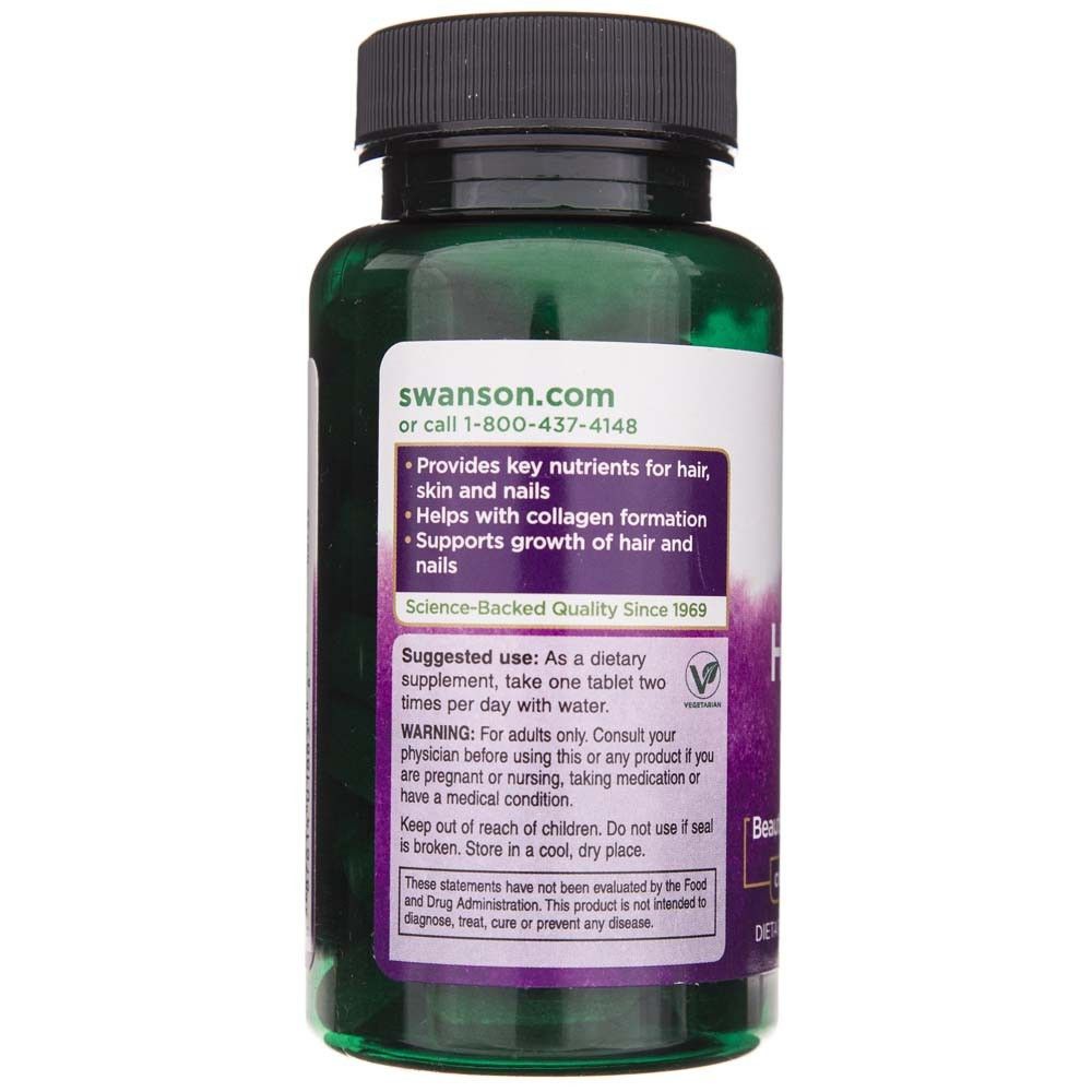 Flacone verde di integratore per capelli, pelle e unghie. Etichetta con istruzioni per l'uso e avvertenze.