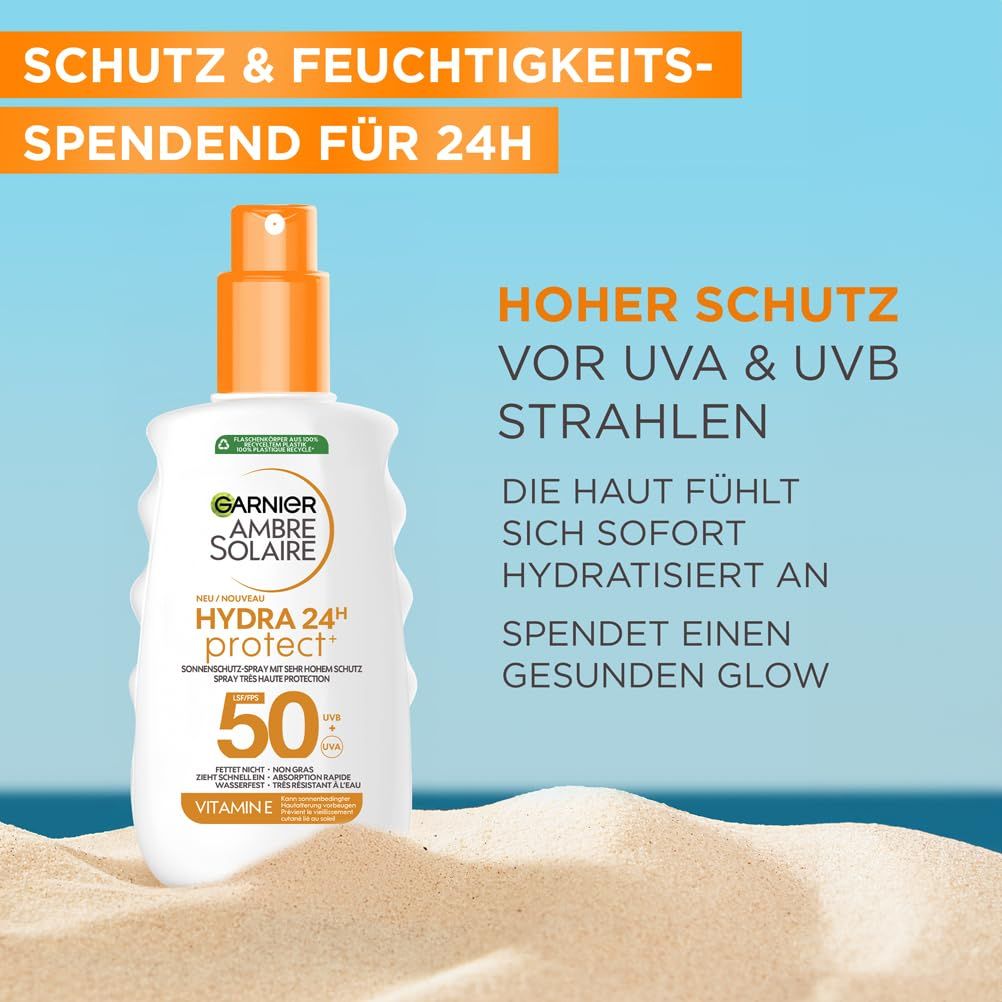 Spray solare su sabbia. Testo: Garnier Ambre Solaire Hydra 24H Protect+, SPF 50. Alta protezione UVA & UVB.