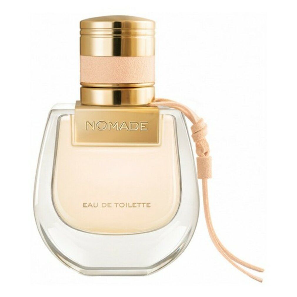 Flacone di profumo con tappo dorato e cinturino in pelle beige. Scritta "NOMADE Eau de Toilette".