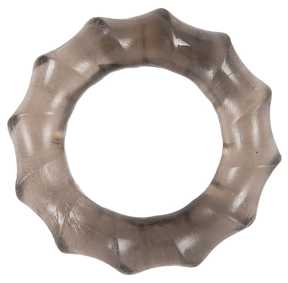 Anello penieno nero e flessibile con una superficie ondulata. L'anello ha una forma rotonda con un foro al centro.