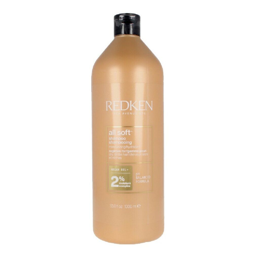 Flacone di shampoo beige con tappo nero. Scritta: Redken, all soft shampoo. 2% Moisture Complex.