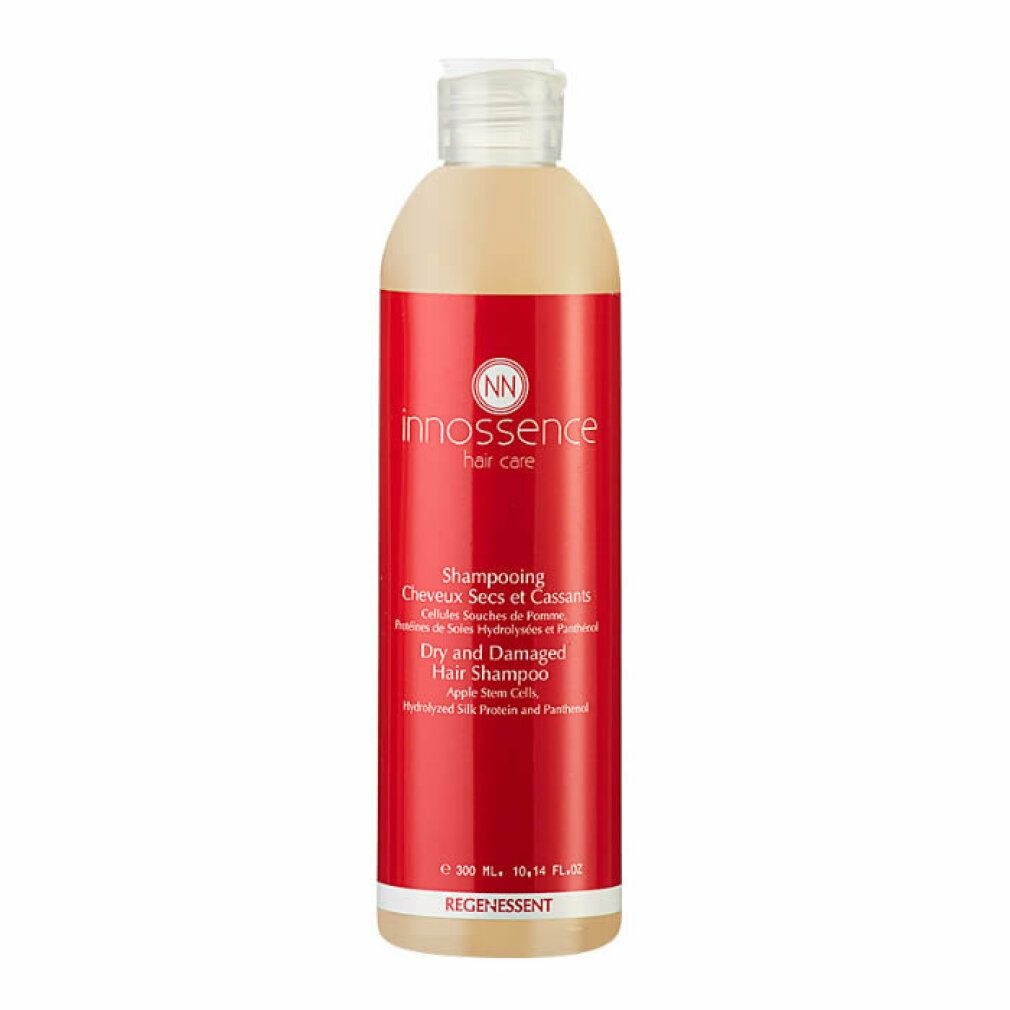 Flacone di shampoo con etichetta rossa. Scritta: Innossence, Shampooing Cheveux Secs et Cassants, Dry and Damaged Hair Shampoo.
