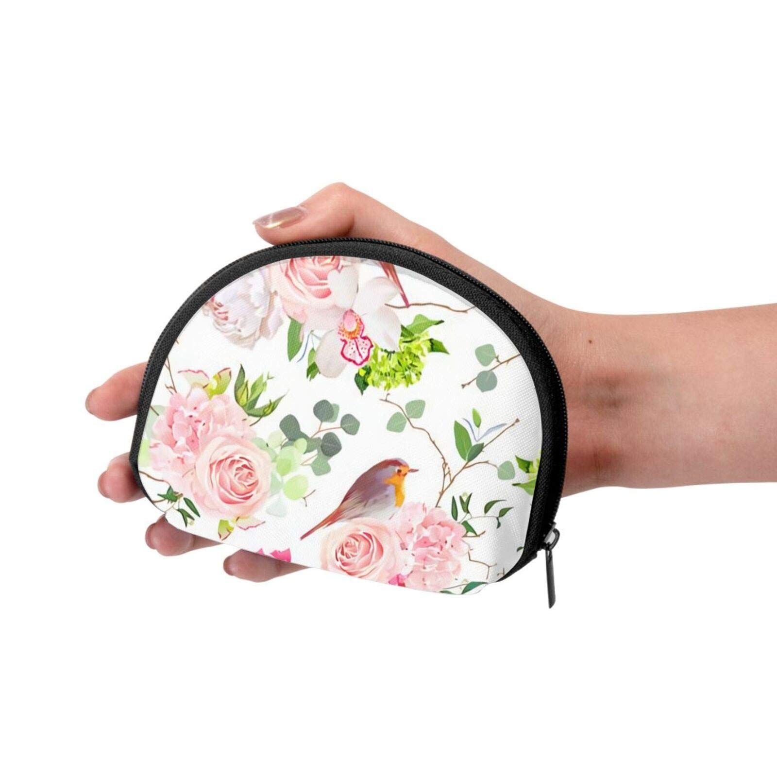 Portafoglio a mezzaluna con motivo floreale e uccello, tenuto in mano. Cerniera nera.