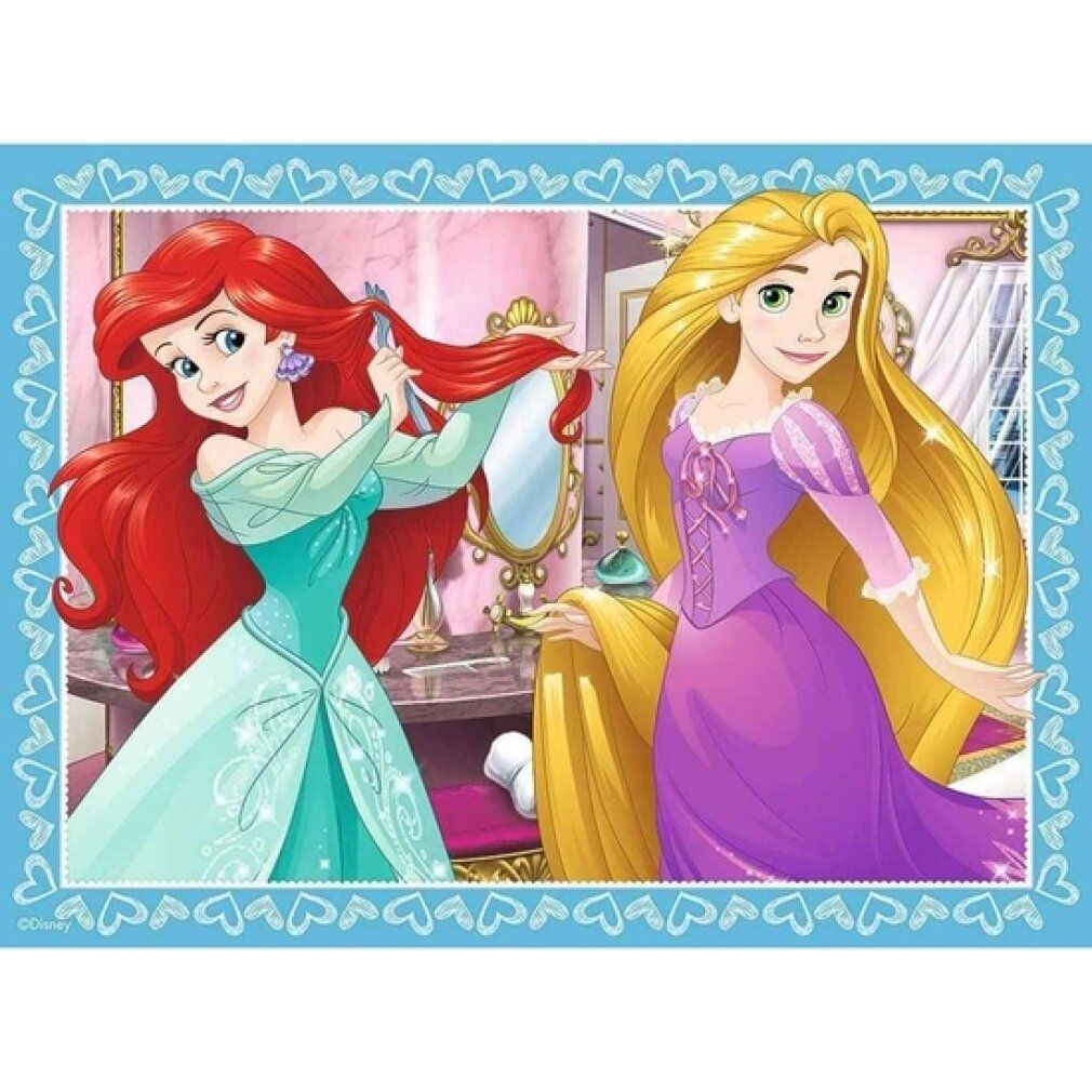 Puzzle con Ariel e Rapunzel. Ariel si pettina, Rapunzel è accanto. Cornice blu con cuori.
