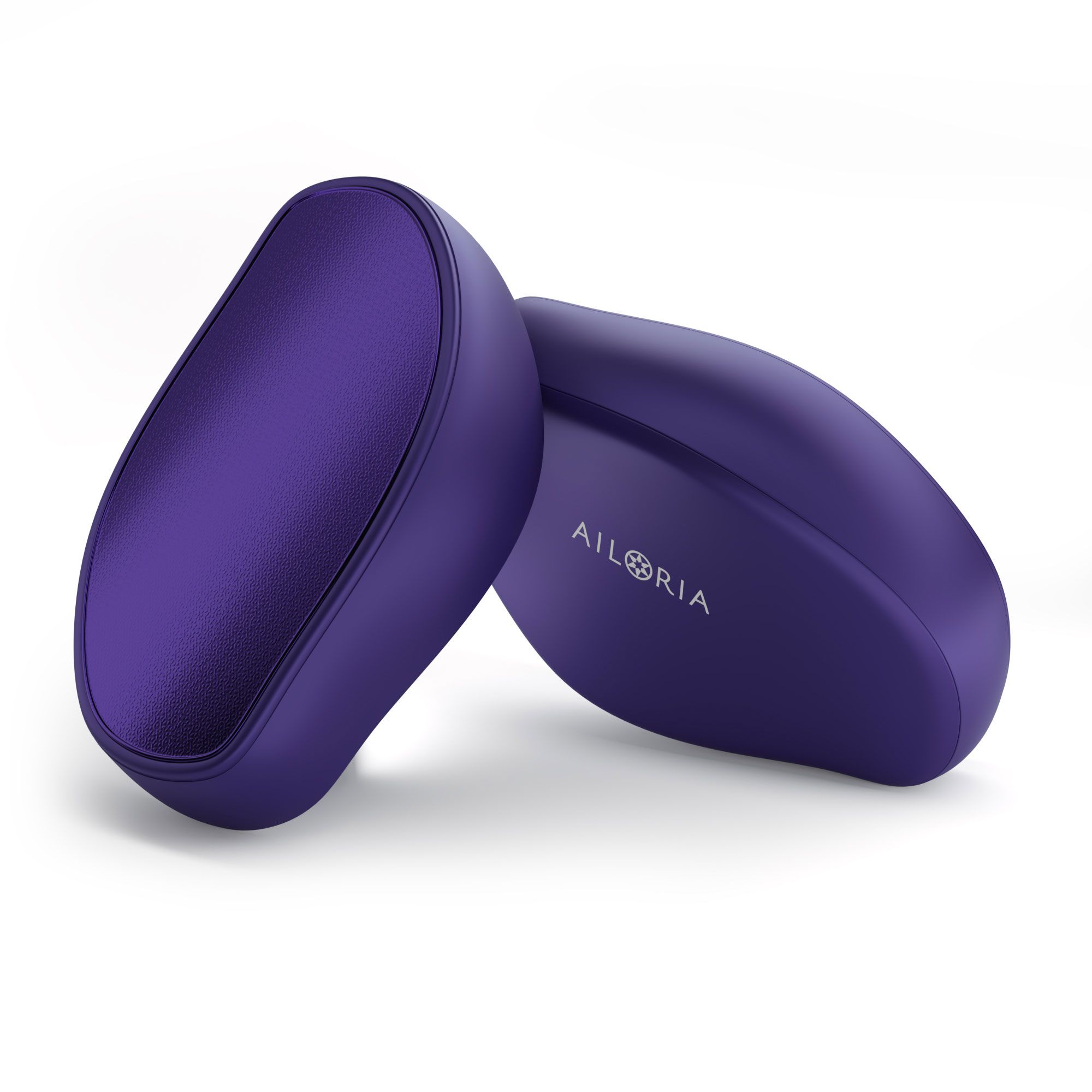 Due esfolianti per piedi viola. Un dispositivo è sdraiato, l'altro accanto.